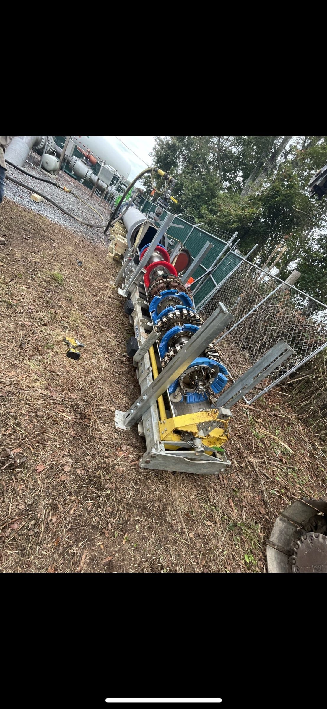 Line and test fittings staged along a hillside right of way
