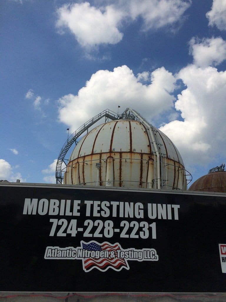 Mobile testing unit signage carrying the 724-228-2231 dispatch number