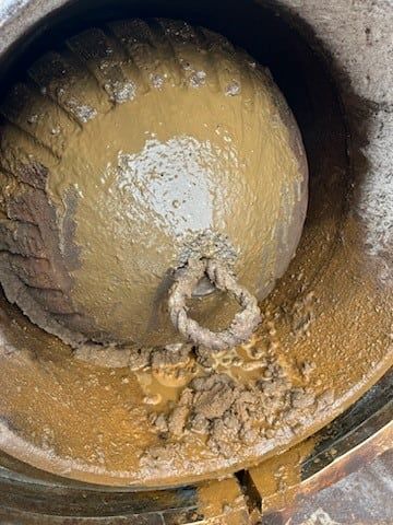 Interior of a receiver barrel holding a returned pig and line debris