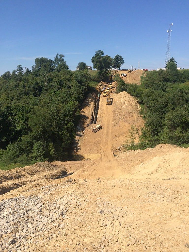 New right of way cut across a wooded hillside