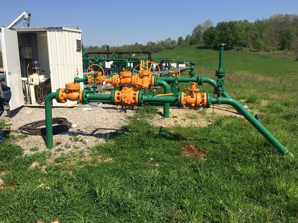 Station valve manifold and control building in an open field