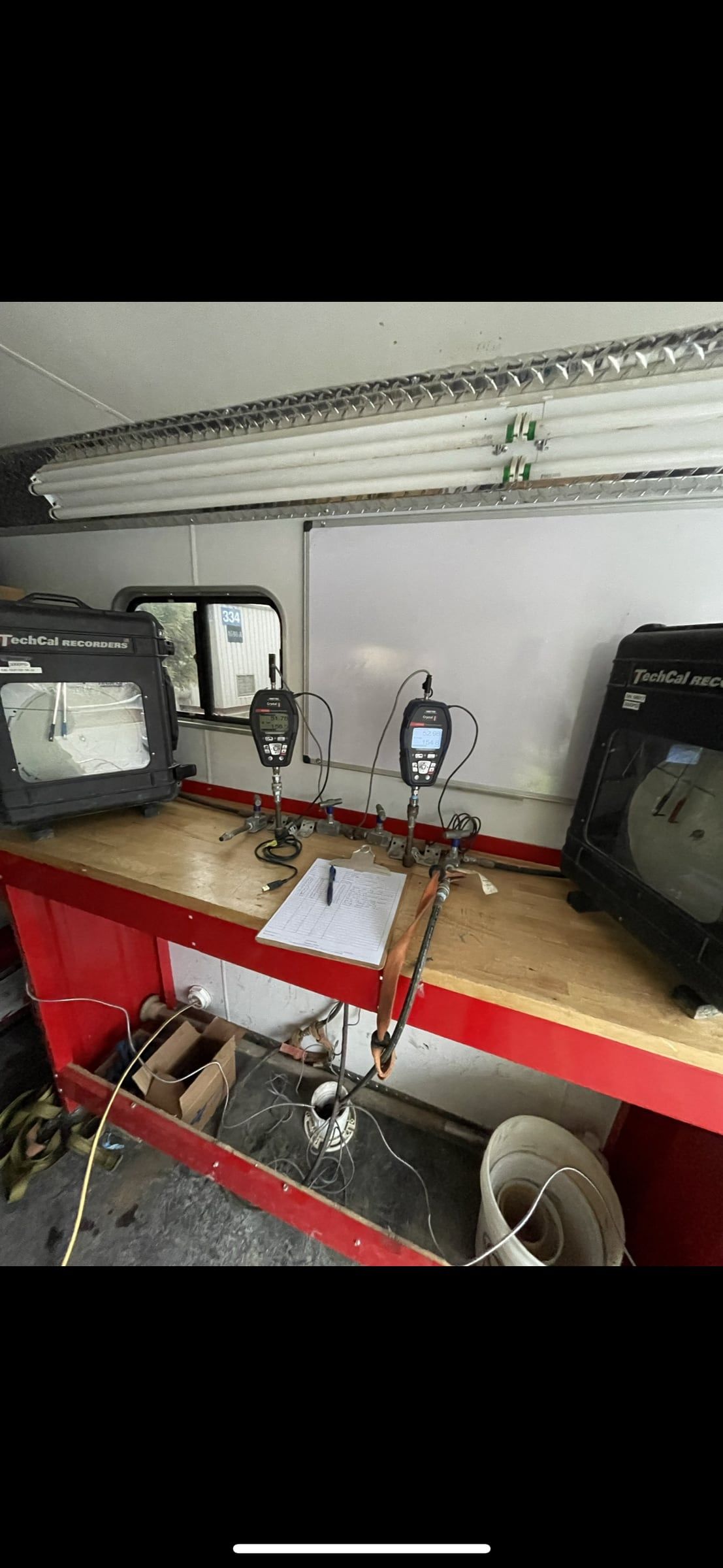Interior of the mobile testing unit with recorders set up on the bench